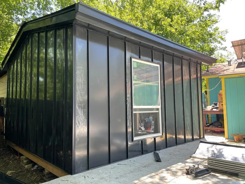 Black standing seam metal wall panels for Roof Inspection in Estherville